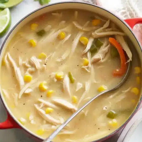 Creamy White Chili Chicken served in a bowl with fresh toppings.