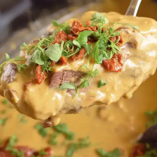 A delicious easy Crock Pot chicken meal featuring spinach and garlic.