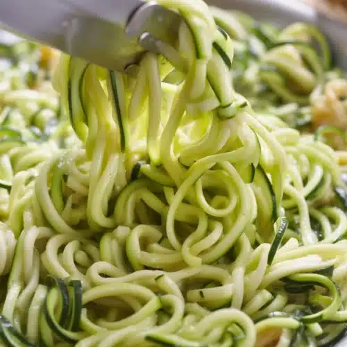 Delicious zucchini noodles tossed with garlic, basil, and parmesan cheese.